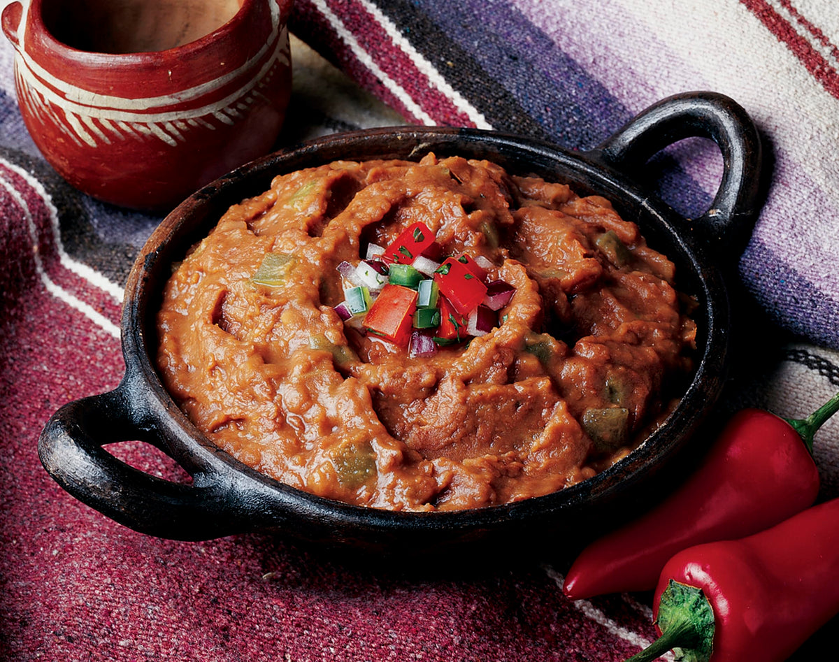 Creamy Amy's refried beans with green chiles served as a creamy vegan side.
