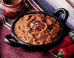 Creamy Amy's refried beans with green chiles served as a creamy vegan side.