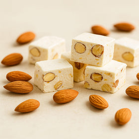Andy Anand almond-filled nougat close-up, highlighting nut texture.