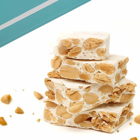 Andy Anand Chocolatier front packaging of sugar-free roasted almond nougat brittle, attractive packaging.