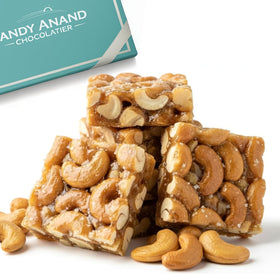 Andy Anand Chocolatier sugar-free cashew brittle cubes, low-carb indulgence for on-the-go snacking.