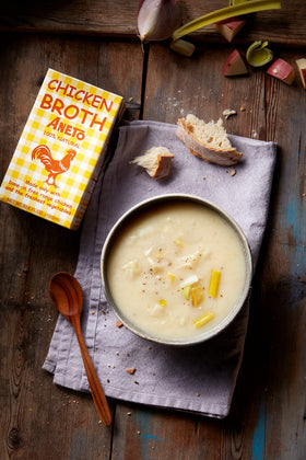 Simmering broth in a pot releases savory aroma ready for soups