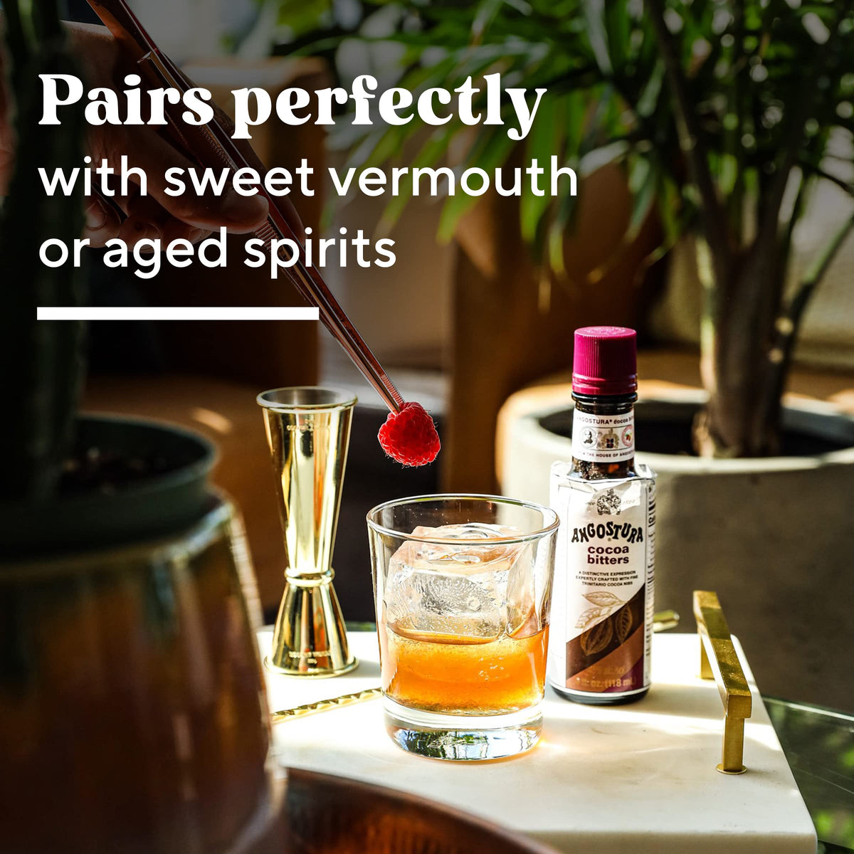 ANGOSTURA Cocoa Bitters bar setup suggests premium mixology tools.