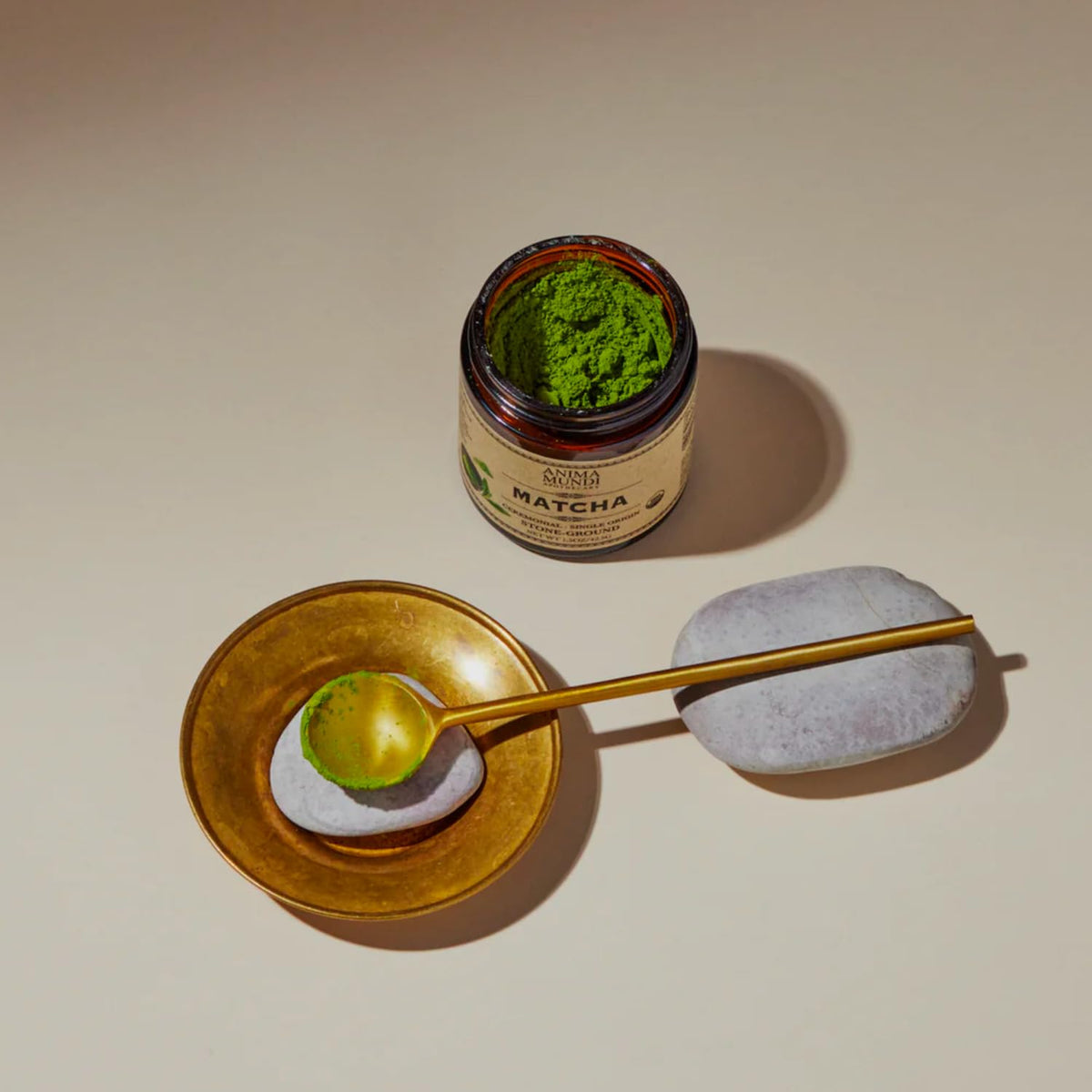 Anima Mundi Matcha brewed cup shows bright emerald tea and gentle lift.