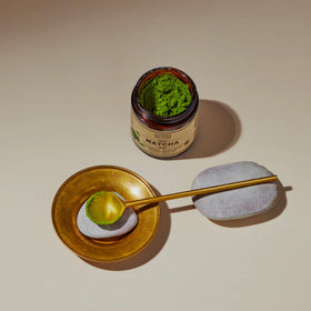 Anima Mundi Matcha brewed cup shows bright emerald tea and gentle lift.