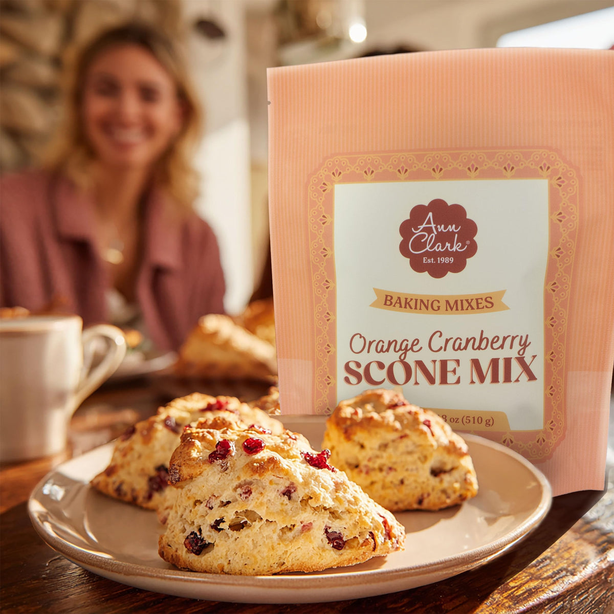 Ann Clark Orange Cranberry Scone Mix pack shot showing golden, flaky scones ready to serve.