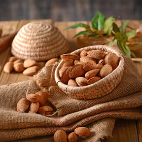 Close-up of Anna and Sarah almonds in shell, natural flavor and textured shells.