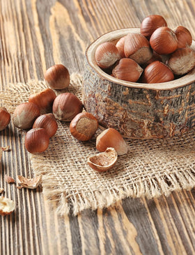 Anna and Sarah hazelnuts in shell close-up, showcasing natural crunch and fresh flavor.