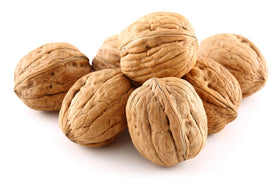Anna and Sarah premium walnuts in shell closeup show rich flavor potential for snacking.