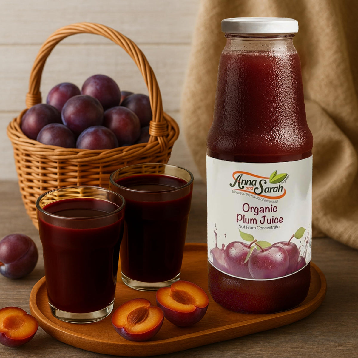 Pouring Anna and Sarah tart plum juice from a glass bottle for bold flavor.