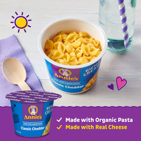 Annie's Deluxe Mac and Cheese in a steaming cup, ready-to-eat comfort.