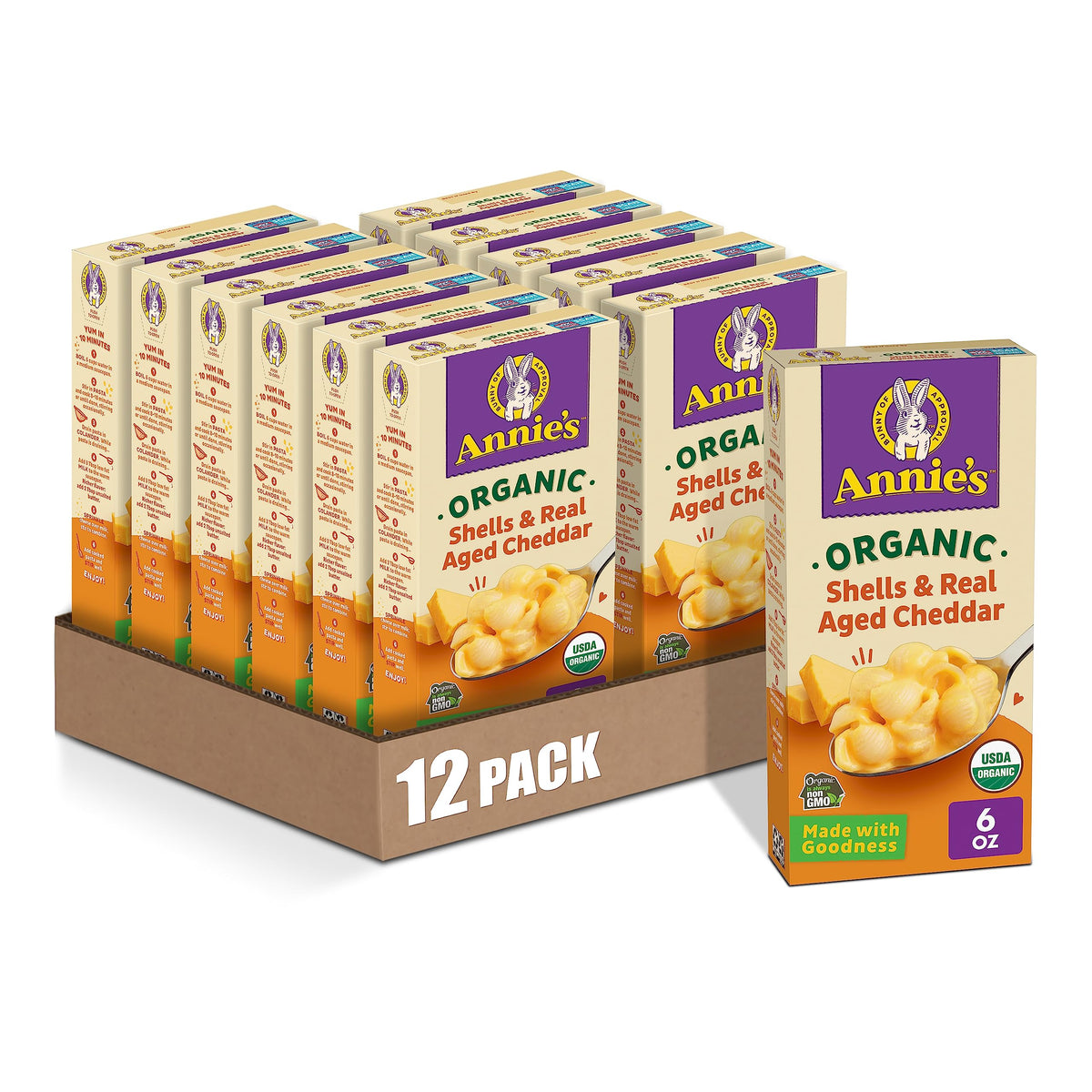 Annie's Organic Shells and Real Aged Cheddar box front, showcasing organic pasta and real cheese.