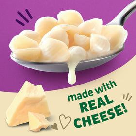 Annie's Organic Shells and White Cheddar cooking in pot with creamy sauce forming.