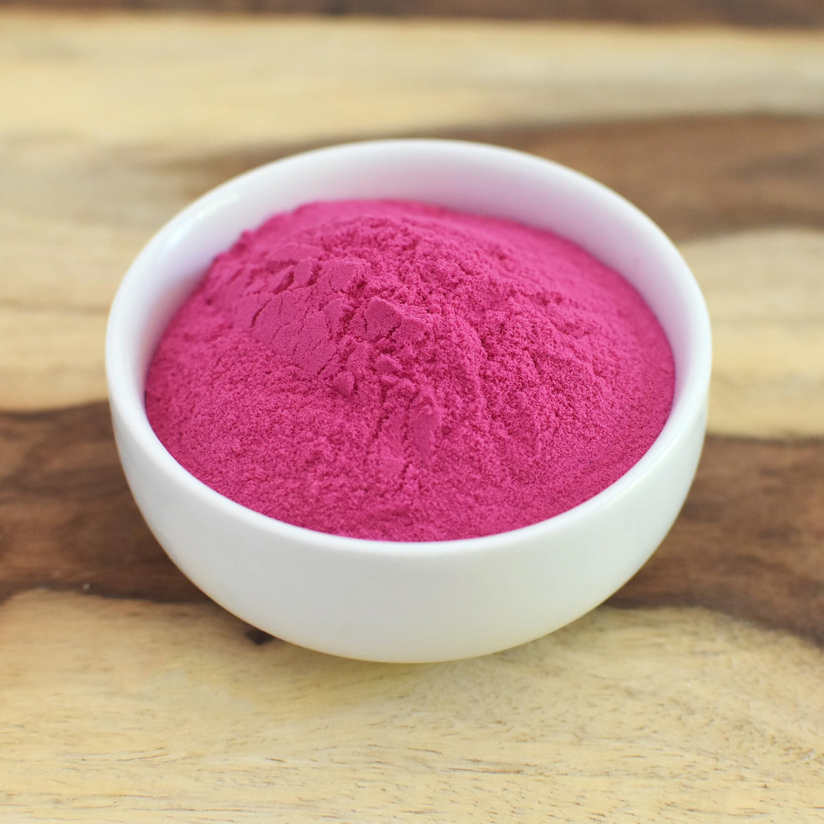 Stirring Anthony's Dragon Fruit Powder into yogurt or oats for a creamy boost.