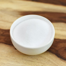 Anthony's Erythritol granules in a glass jar, showcasing zero calorie sweetness.