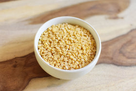 Anthony's Organic Split Yellow Mung Beans simmering in pot, rich flavor potential for hearty dal.
