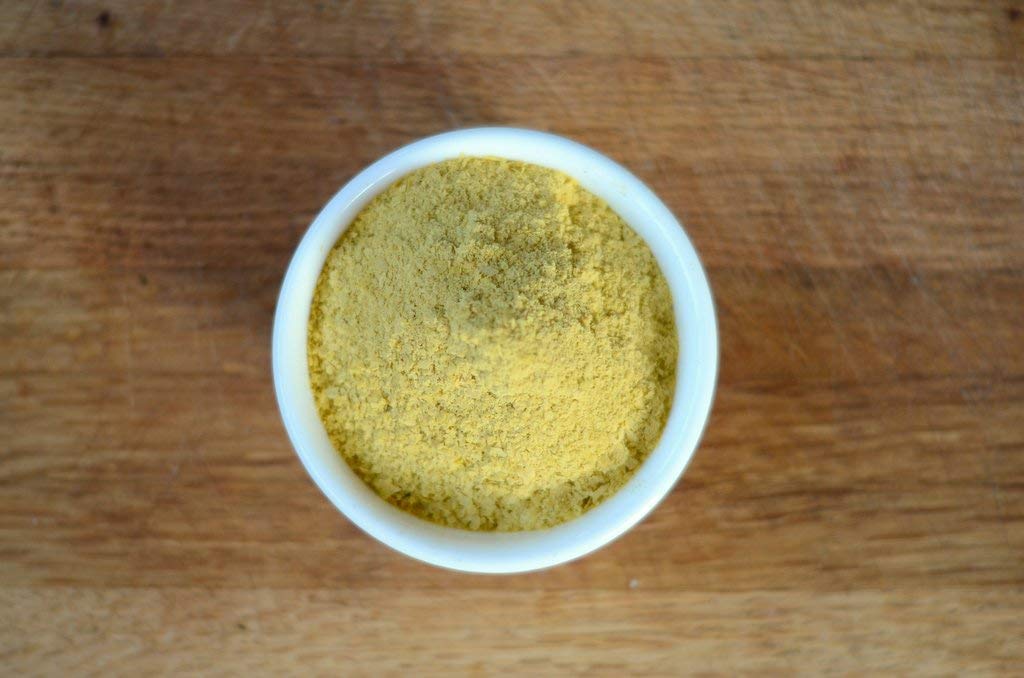 Salad bowl with Anthony's Nutritional Yeast Flakes for a plant-based protein boost.