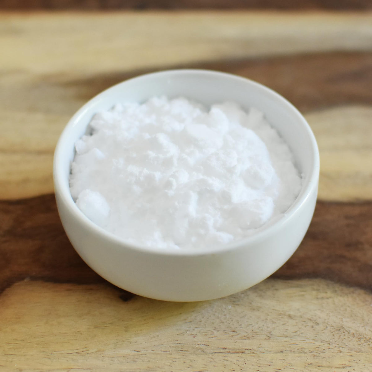 Anthony's Erythritol Powder pours into measuring cup for recipe prep.