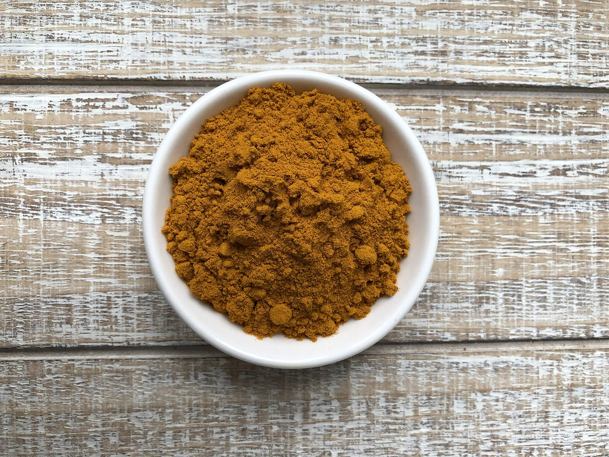 Anthony's turmeric powder added to a curry dish, delivering vibrant color and aroma