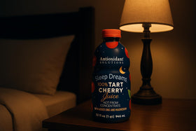 Glass hero-shot suggests a comforting nightly ritual with Sleep Dreams.