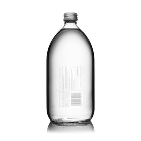 Antipodes bottles in a minimalist setup, sustainable glass packaging appeal.