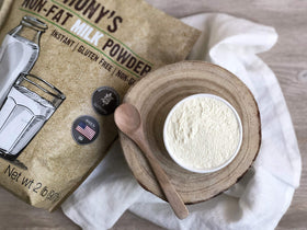 Anthony's Non Fat Milk Powder on kitchen counter suggests baking and cooking versatility.