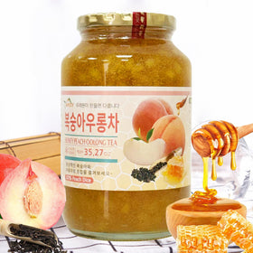 Apexy honey citron tea close-up shows fruit slices and honey.