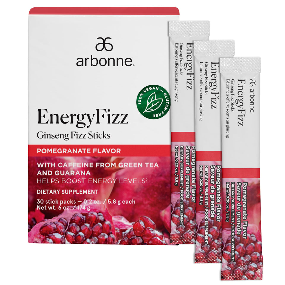 Arbonne Ginseng Energy Sticks in a glass with pomegranate fizz for a refreshing boost.