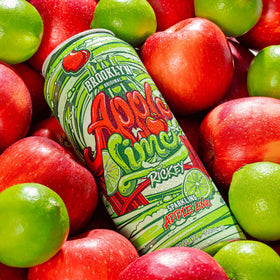 A close-up of AriZona Apple Lime Rickey showing real juice and fizzy bubbles.