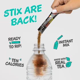 AriZona Arnold Palmer Stix in a clear glass showing the prepared blend.