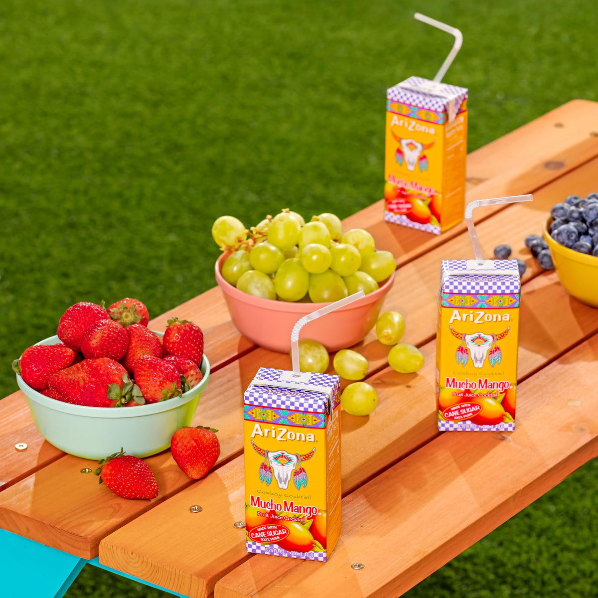 AriZona Mucho Mango box poured into a glass for a tropical, easy sipping experience.