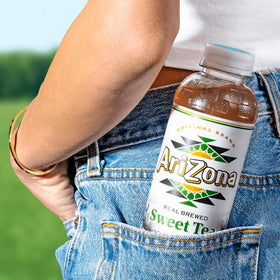 Sunlit porch scene with AriZona Sweet Tea, perfect for relaxation.
