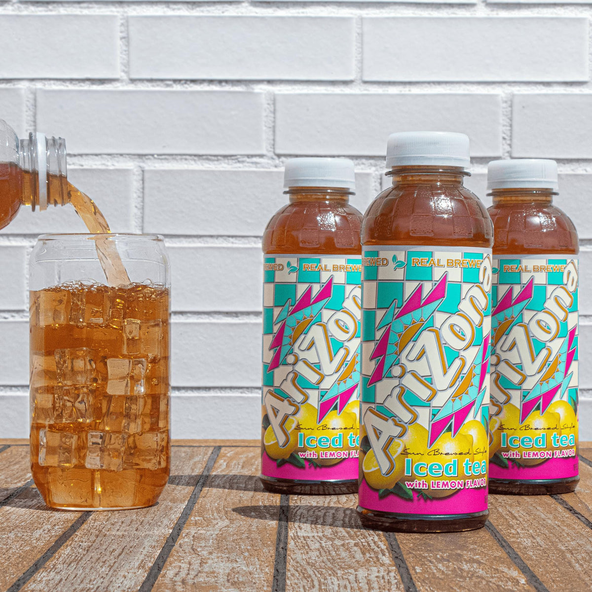 Arizona Tea bottles in refrigerator display, ready for family gatherings and on-the-go.