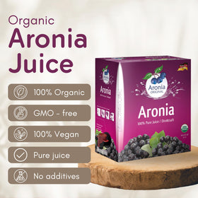 Aronia Original glass close-up showing deep tart chokeberry juice for tasting.