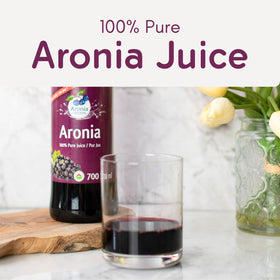 Aronia Original juice in a glass served, great with water or smoothies.