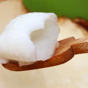 Aroy-D serving bowl with coconut meat and syrup, perfect topping for fruit bowls