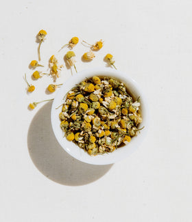 Art of Tea organic chamomile flowers close-up showing natural ingredients for a soothing sip.