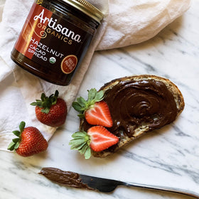 Artisana Hazelnut Cacao Spread ingredients shown, highlighting organic hazelnuts and cacao.