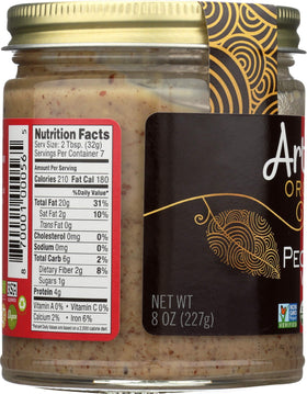 Artisana organic pecan butter jar on a kitchen counter