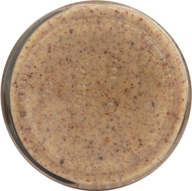 Artisana pecan butter texture shot emphasizing smooth, spreadable finish