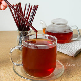 Arvoli Elderberry Honey Sticks on a charcuterie board; a graceful pairing option.