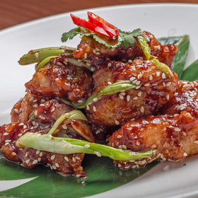 Asian Fusion Low Sodium Teriyaki sauce bottle pouring glossy glaze.