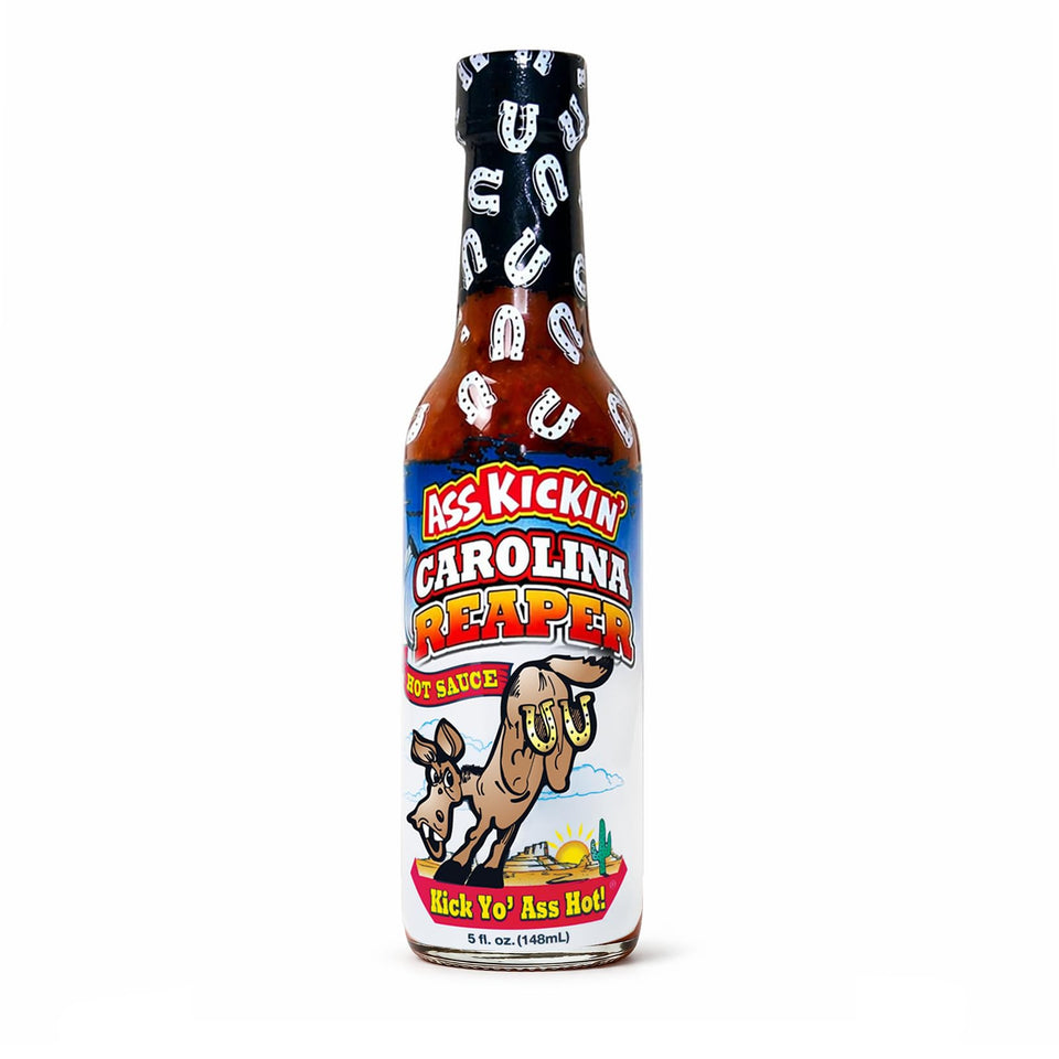 ASS KICKIN' Carolina Reaper hot sauce bottle pouring for wings and bold flavor