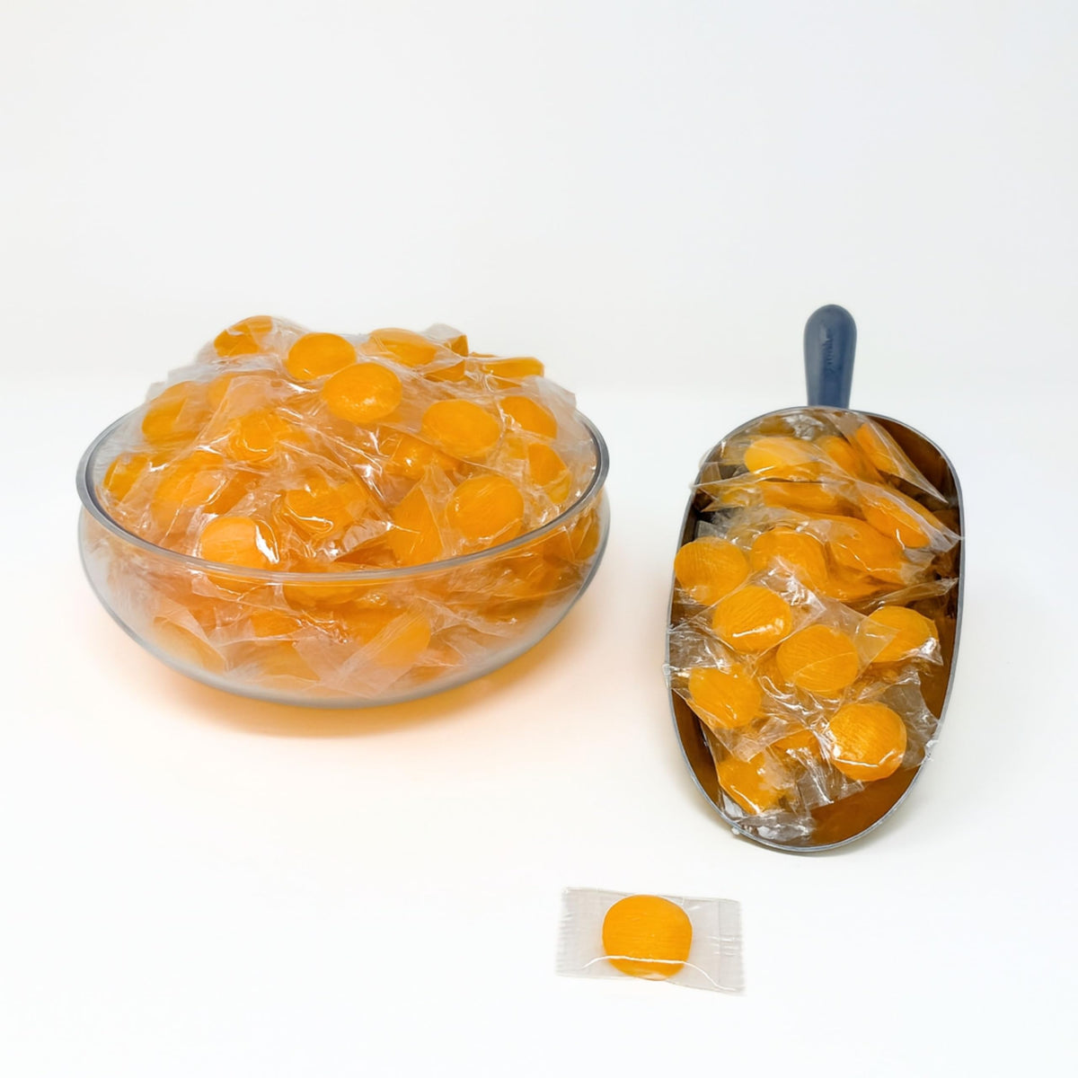 Assortit Peach Buttons bag side view shows twist-wrap packaging for on-the-go snacking.