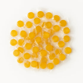 Assortit Peach Buttons in a serving bowl makes a festive candy centerpiece.
