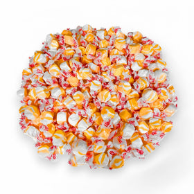Assortit Peaches N Cream taffy piece closeup highlights chewy texture