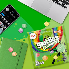 Assortit Skittles Collab Sours Gummies flavors collage highlighting strawberry, orange, grape, lemon, and green apple.