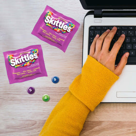 Assortit Skittles fun-size packs inside resealable bag for on-the-go.