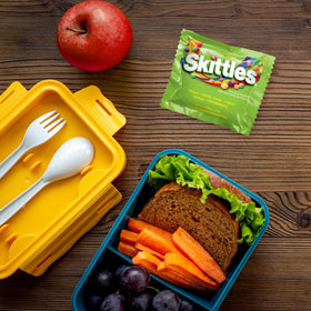 Assortit Skittles Sour in Easter baskets for cheerful treats.