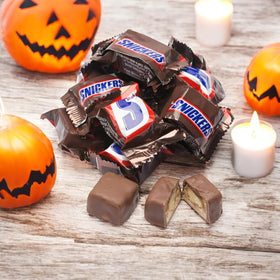 Close-up of creamy caramel and roasted peanuts in Snickers Minis by Assortit.